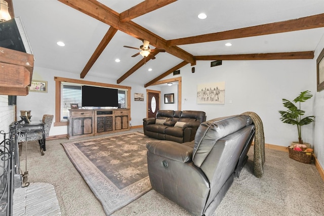 carpeted living room featuring ceiling fan and lofted ceiling with beams