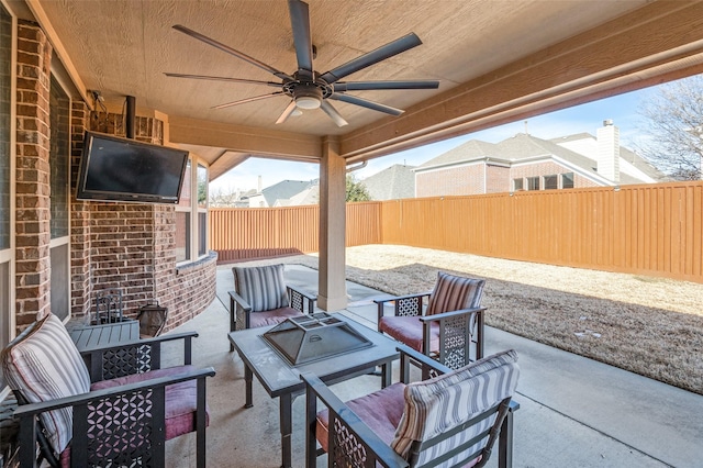 view of patio / terrace featuring ceiling fan and an outdoor living space