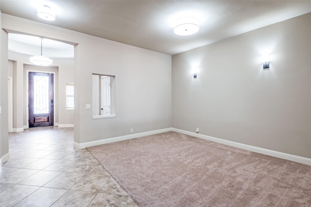 empty room with light tile patterned floors