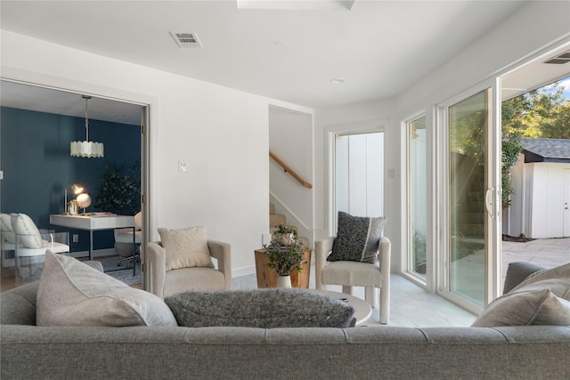 living room featuring a notable chandelier