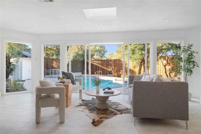 sunroom / solarium with a skylight