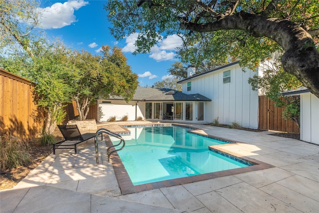 view of swimming pool featuring a patio area