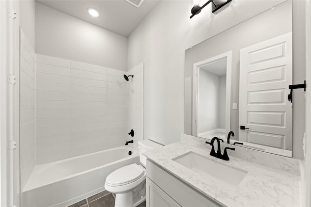 full bathroom with tile patterned flooring, vanity, bathing tub / shower combination, and toilet