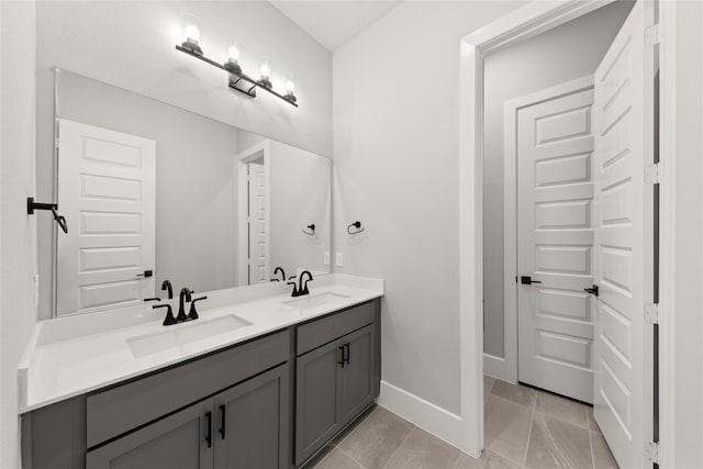 bathroom with tile patterned floors and vanity