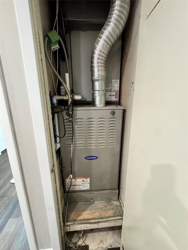 utility room with heating unit