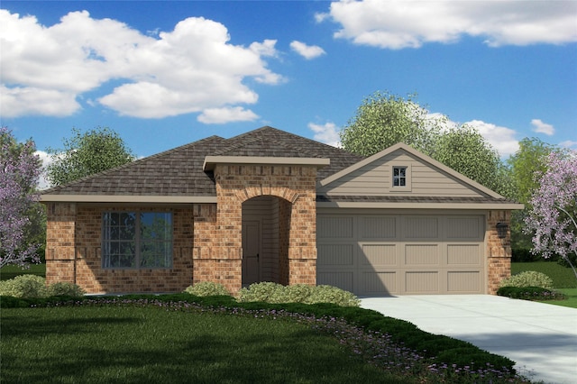 view of front of home featuring a garage and a front yard