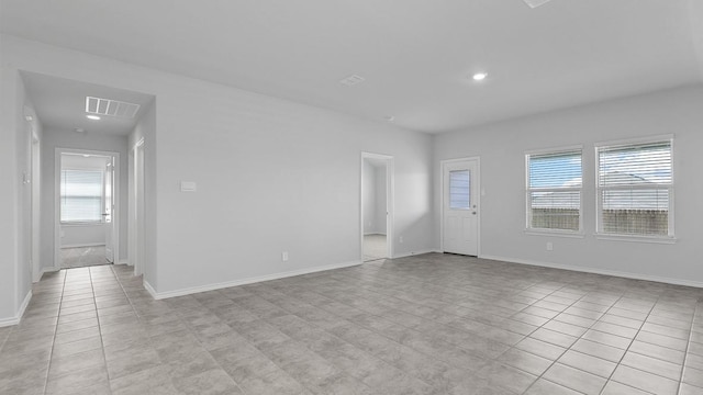 empty room featuring light tile patterned floors