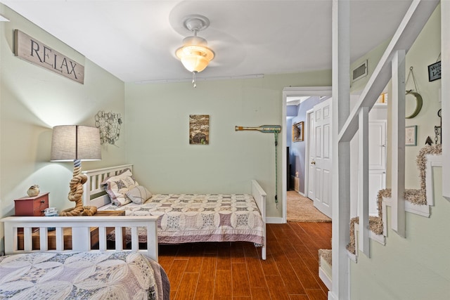 bedroom featuring dark hardwood / wood-style floors