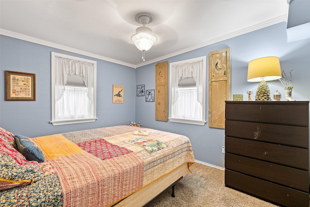 bedroom with ceiling fan, light colored carpet, and ornamental molding