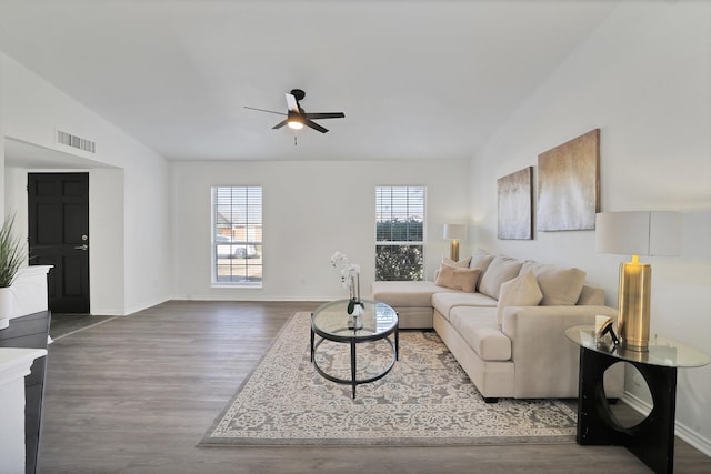 living room with ceiling fan, wood-type flooring, and vaulted ceiling