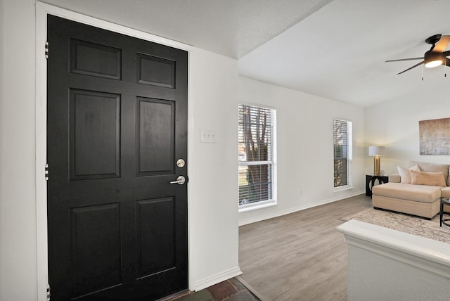 entryway featuring ceiling fan and hardwood / wood-style floors