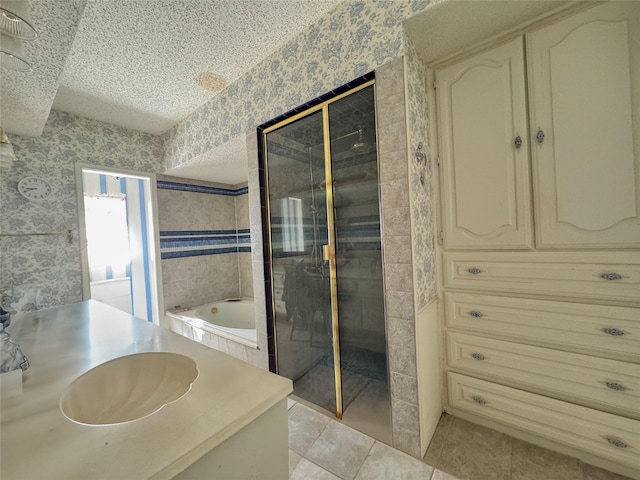 bathroom with separate shower and tub, vanity, and tile patterned floors