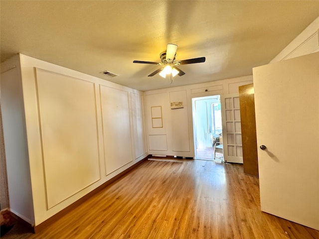 unfurnished bedroom featuring ceiling fan and light hardwood / wood-style flooring