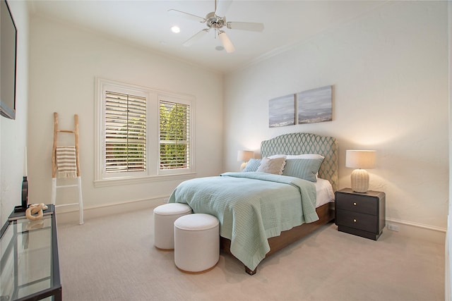 bedroom with ornamental molding, ceiling fan, baseboards, and carpet floors