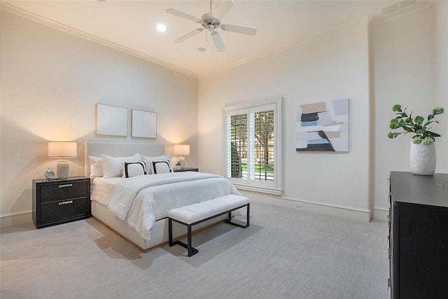 bedroom featuring light colored carpet, a ceiling fan, baseboards, and ornamental molding