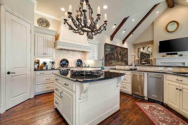 kitchen featuring custom exhaust hood, a center island, tasteful backsplash, vaulted ceiling with beams, and dark stone counters