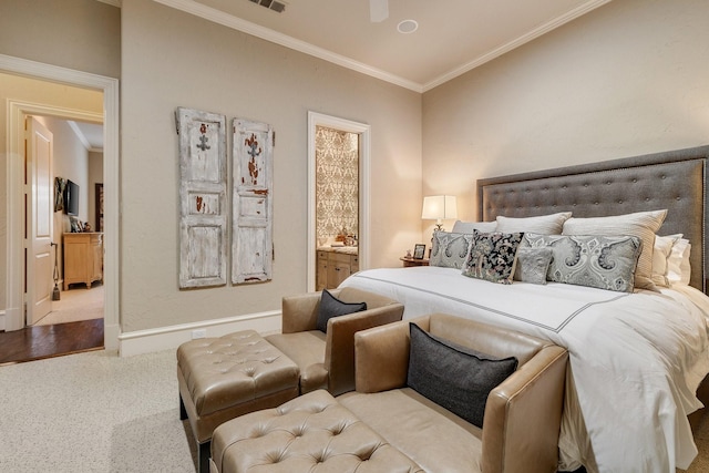 carpeted bedroom with ceiling fan, connected bathroom, and ornamental molding