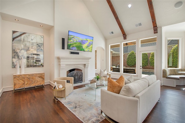 living room featuring visible vents, high vaulted ceiling, dark wood finished floors, and a fireplace