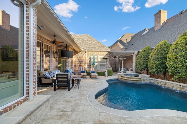 view of swimming pool with an in ground hot tub, a patio, ceiling fan, and outdoor lounge area