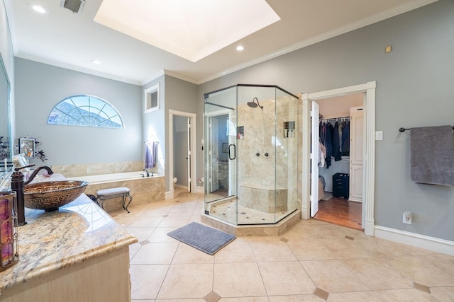 bathroom featuring sink, tile patterned floors, and crown molding