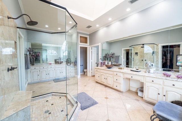 bathroom featuring vanity, a high ceiling, and walk in shower