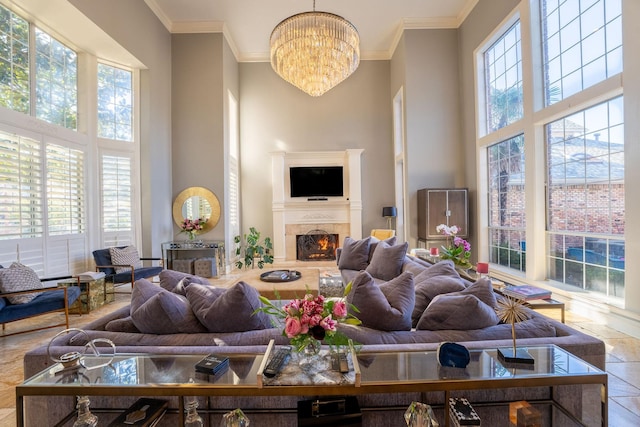 tiled living room featuring a towering ceiling and an inviting chandelier