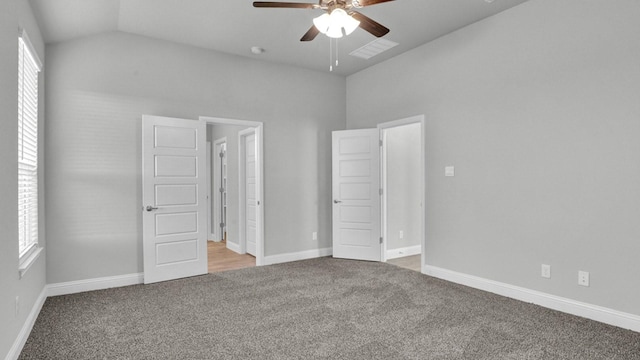 unfurnished bedroom with vaulted ceiling, ceiling fan, and light carpet