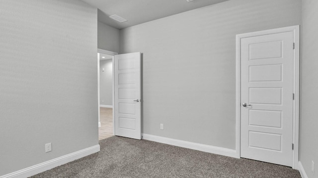 unfurnished bedroom featuring carpet