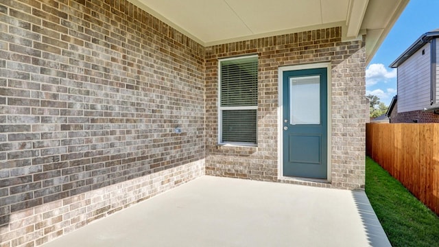 doorway to property with a patio