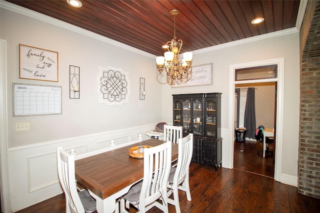 dining room with dark hardwood / wood-style floors, crown molding, a chandelier, and wooden ceiling