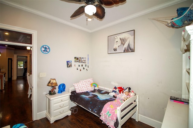 bedroom featuring ceiling fan, dark hardwood / wood-style flooring, and ornamental molding