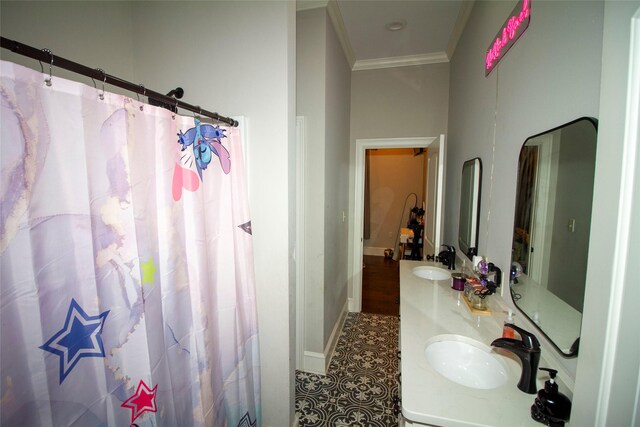 4201 Linda Ln, Shreveport, LA 71107 - full bath with ornamental molding, double vanity, baseboards, a shower with shower curtain, and tile patterned flooring