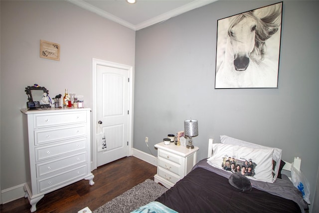 bedroom featuring crown molding and dark hardwood / wood-style floors