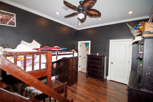 bedroom with ceiling fan, dark wood-type flooring, and crown molding