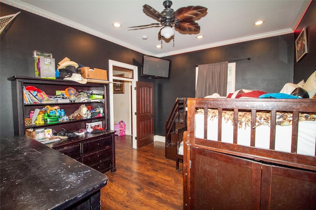 bedroom with ceiling fan, dark hardwood / wood-style floors, and ornamental molding