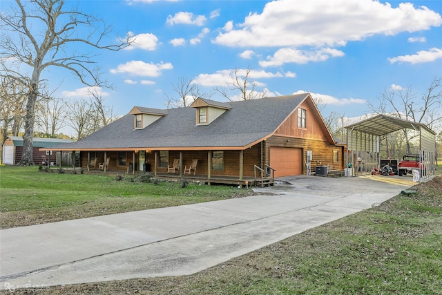 view of front of house featuring a front lawn, a carport, central AC unit, a garage, and a porch