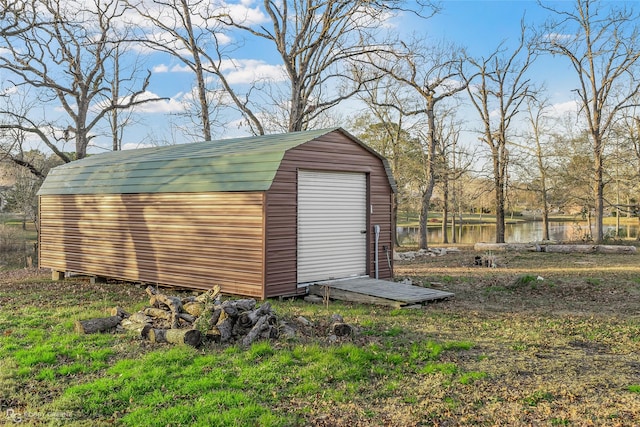 view of outbuilding with a water view