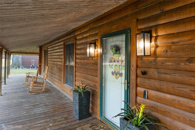 doorway to property with covered porch