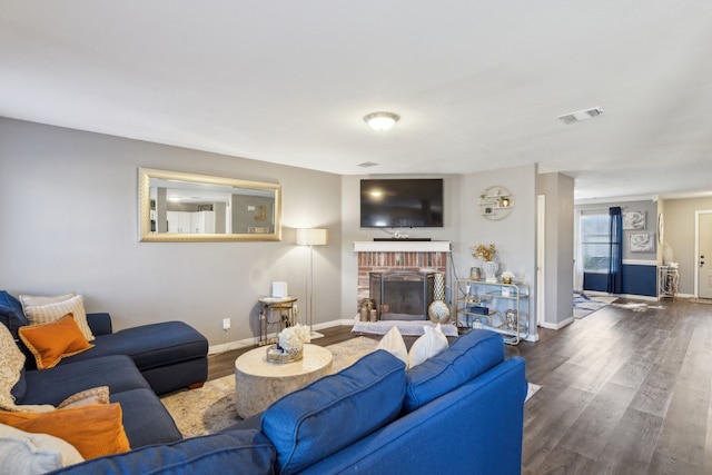 living room with a fireplace and hardwood / wood-style floors