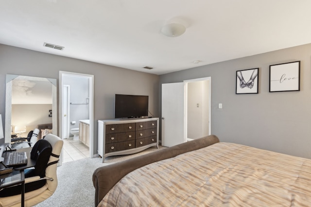 carpeted bedroom with ensuite bathroom