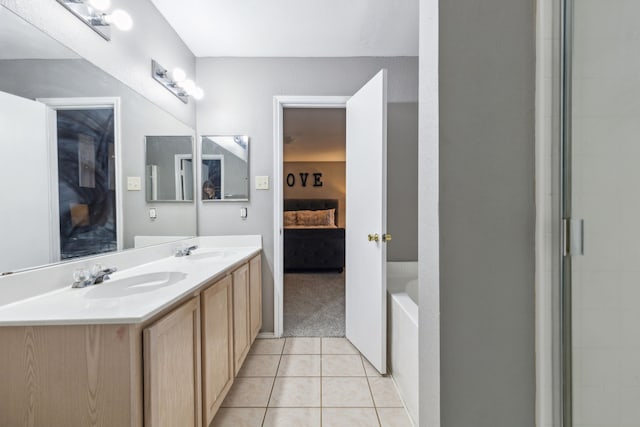 bathroom featuring independent shower and bath, tile patterned floors, and vanity