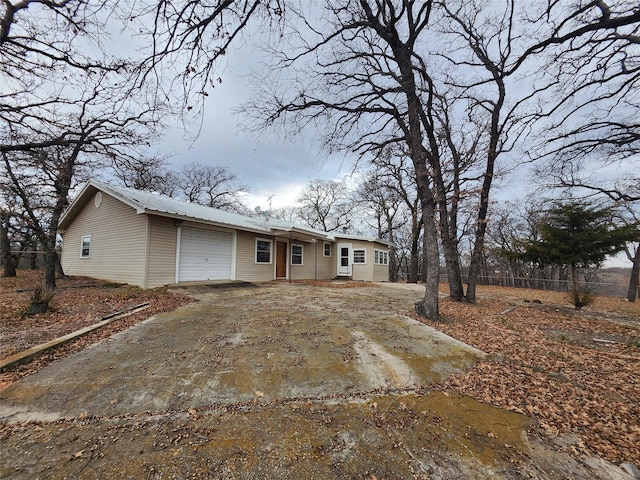 back of property with a garage