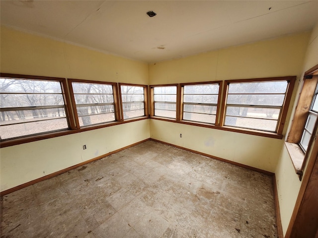 unfurnished sunroom with plenty of natural light