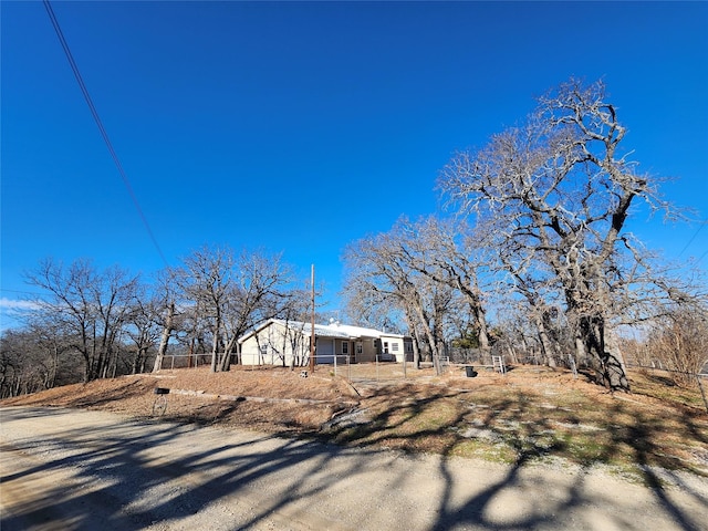 view of home's exterior featuring fence