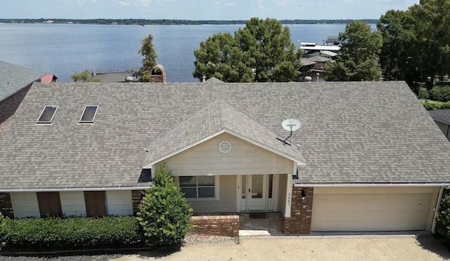 birds eye view of property featuring a water view