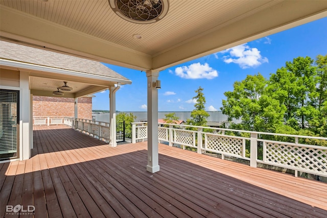 wooden terrace featuring ceiling fan