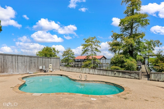 view of pool featuring a patio area