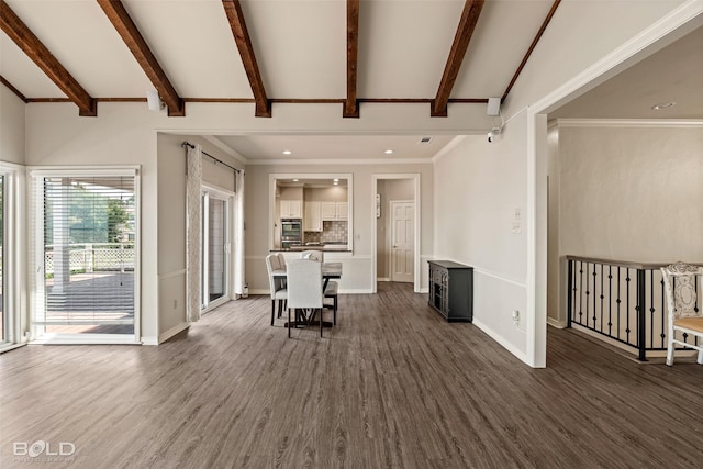 unfurnished living room with beam ceiling and dark hardwood / wood-style flooring