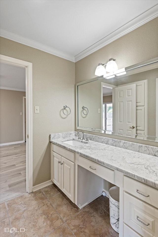 bathroom featuring vanity and crown molding