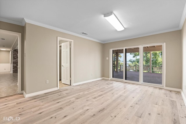 empty room with ornamental molding and light wood-type flooring